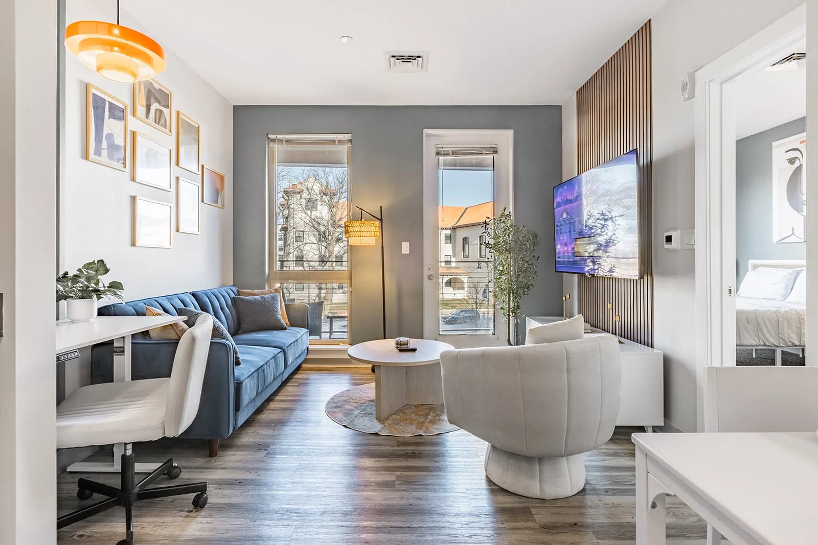 Polished R Living furnished living room with coordinated seating and warm lighting