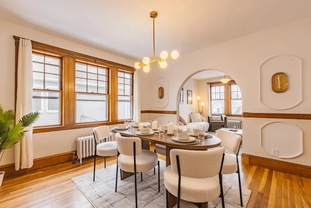 Nonantum dining room after cohesive furnishing and lighting updates
