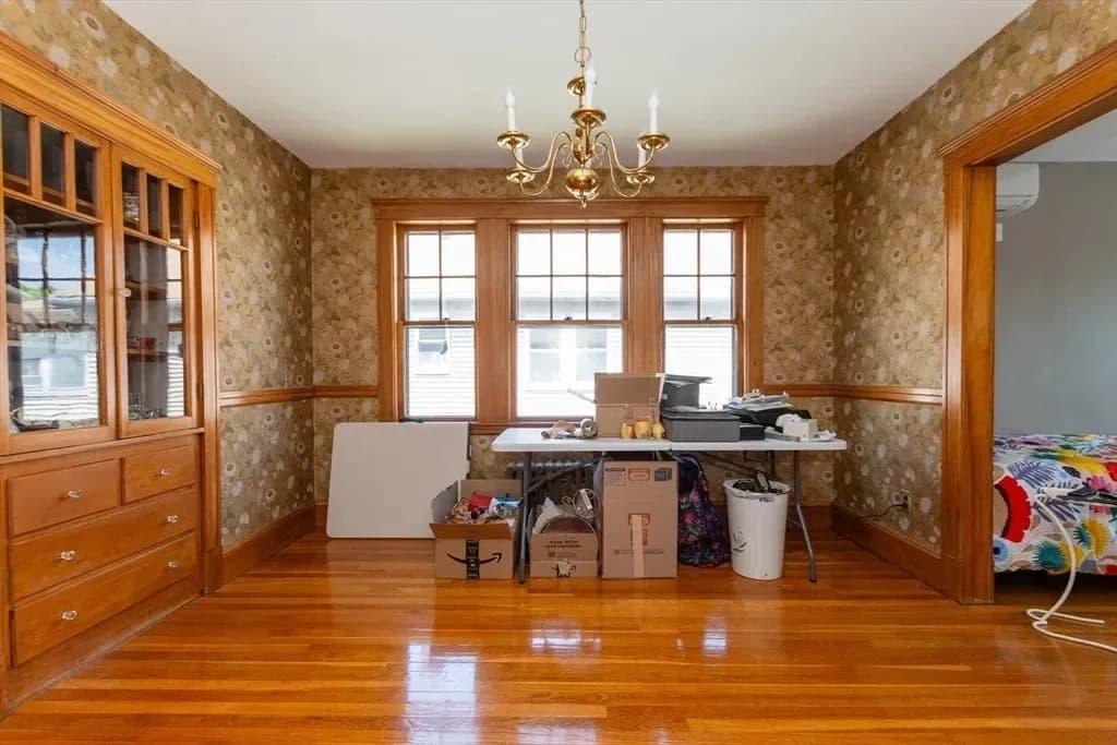 Dining room before the design transformation, used for storage without a defined dining layout